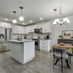1-bedroom condo townhouse for sale in Hamilton — 47 Bishop Reding Trail (Photo 1)